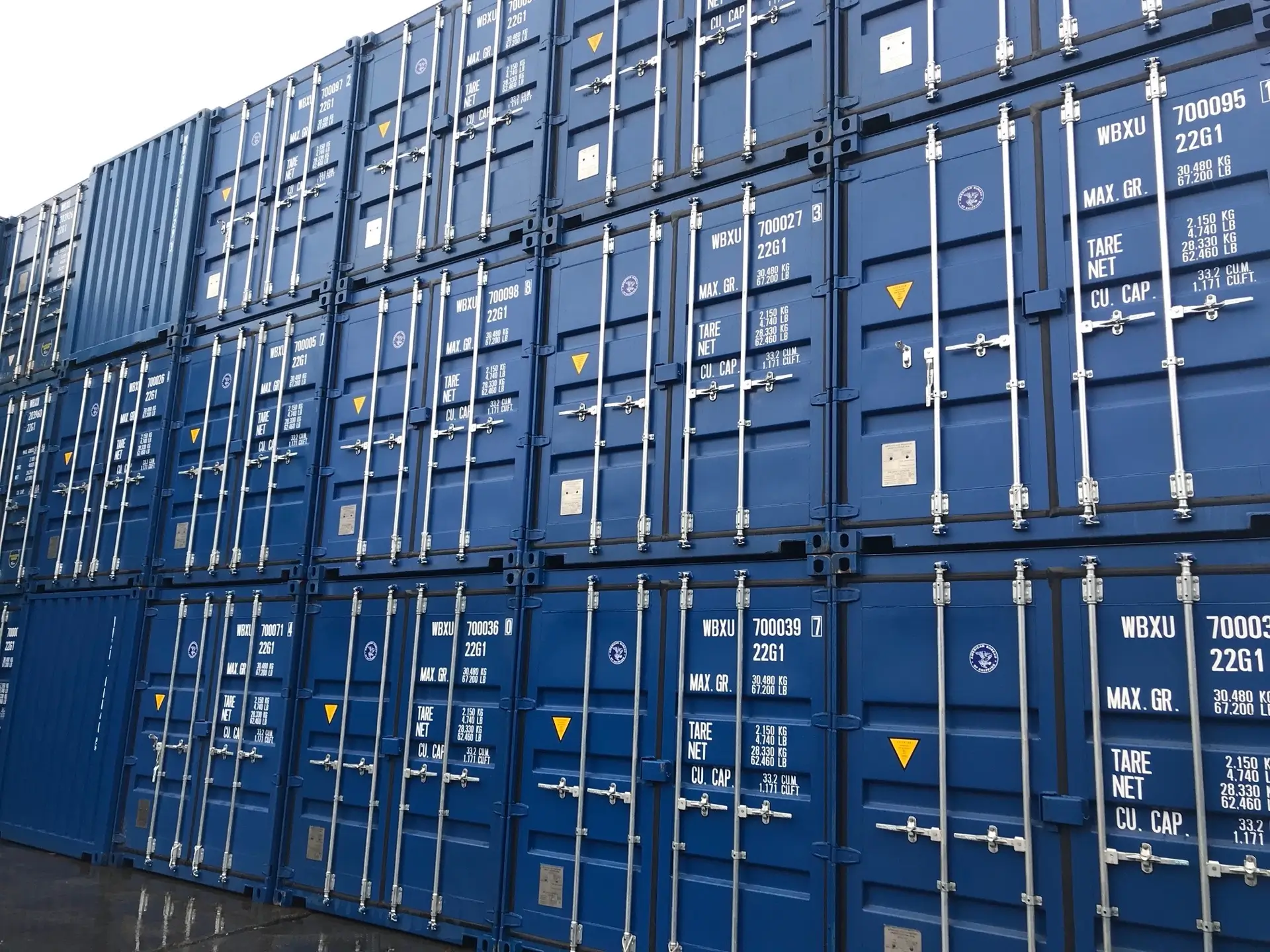 A stack of blue shipping containers