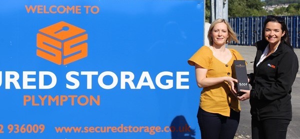 Secured Storage director Natalie Payne receiving an award from Willbox Regional Sales Manager Laura Johns