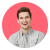 Smiling man with short hair wearing a light gray shirt on a white background.