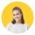Smiling young woman with long blonde hair wearing a casual gray top against white background.