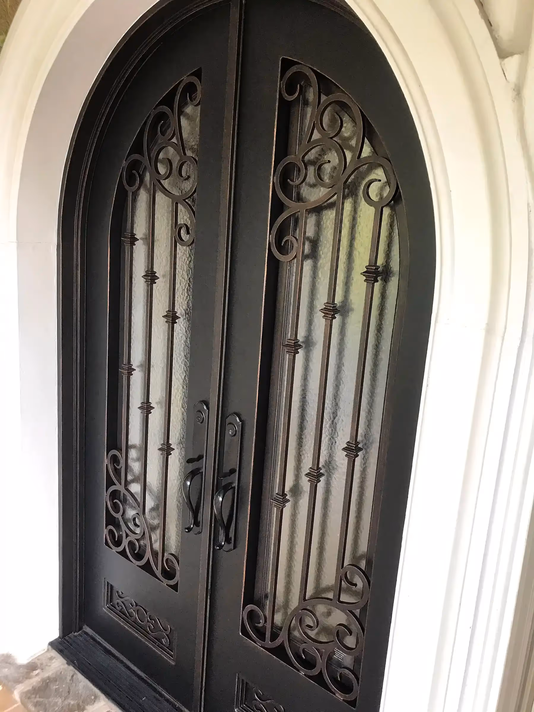 Fantasy Finishes | Iron entryways are a popular architectural choice for homeowners.