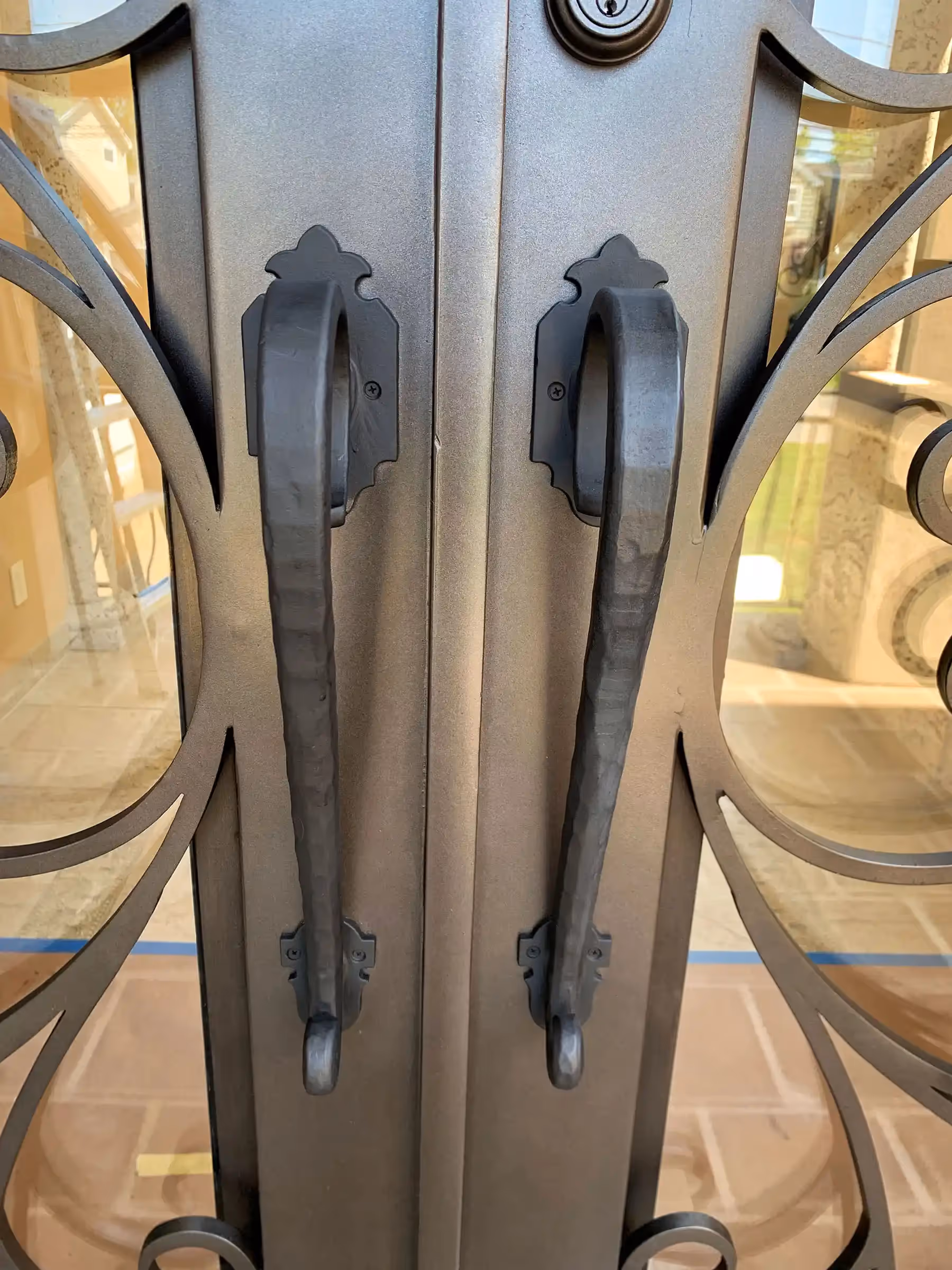 Fantasy Finishes | Iron entryways are a popular architectural choice for homeowners.
