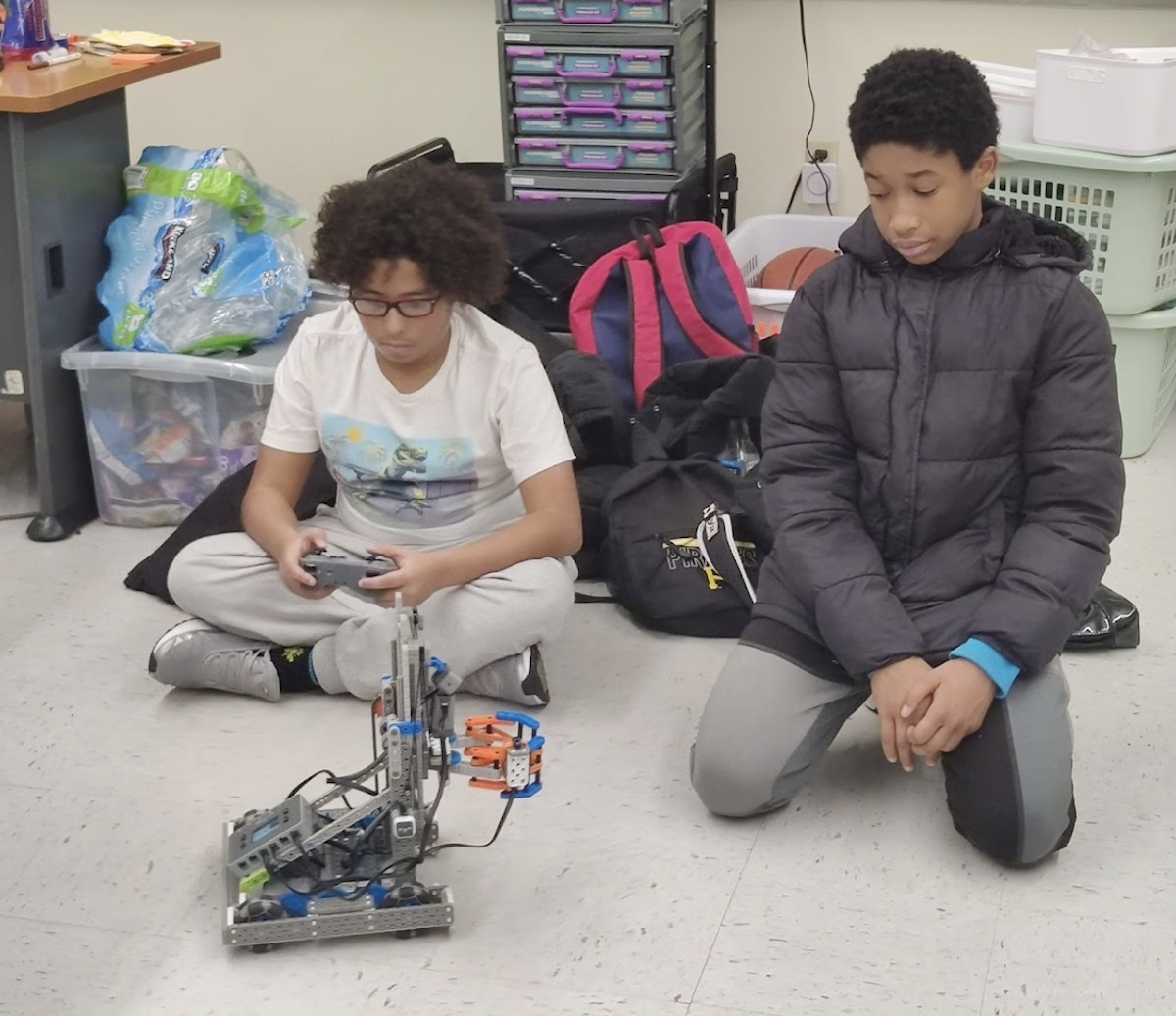 Middle schoolers at Clairton come together after school to work on their robots. 
