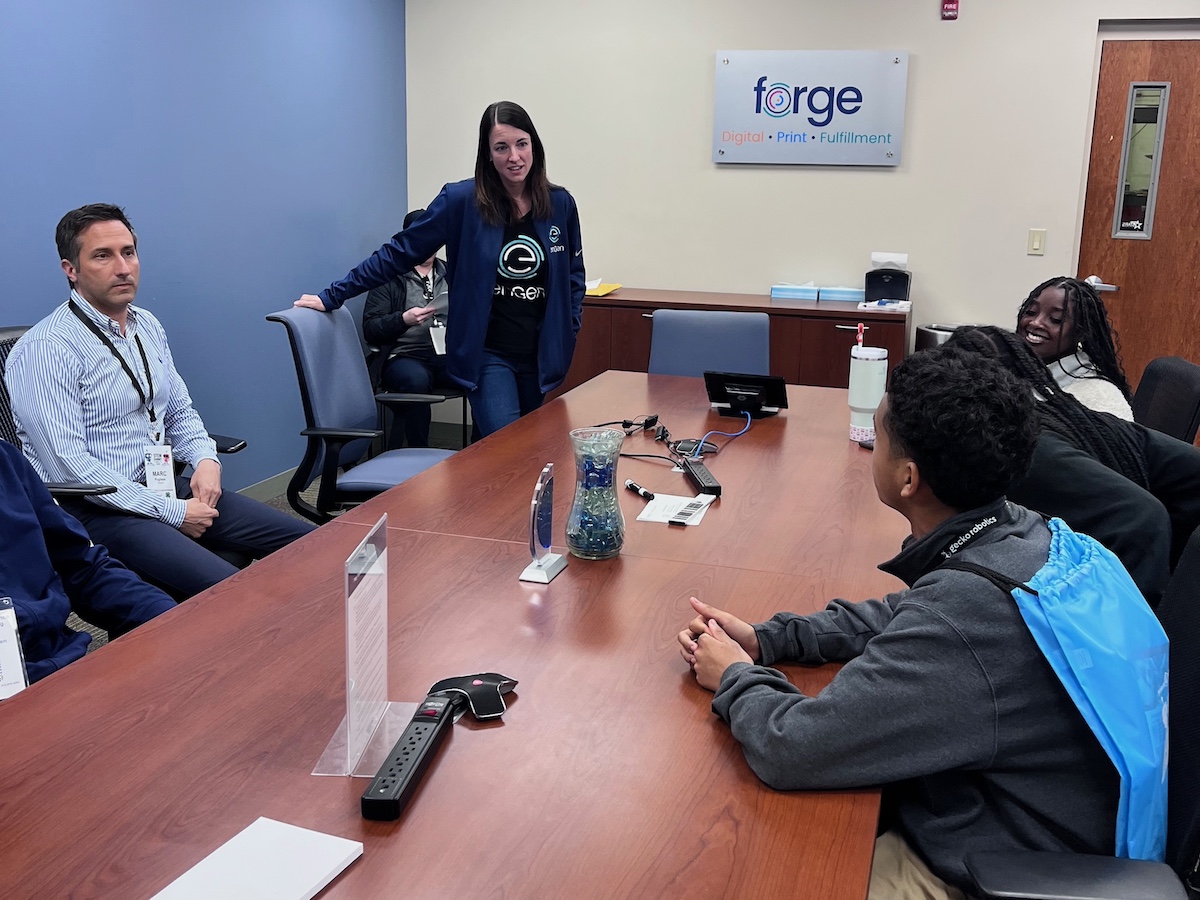 Students listening to an enGen employee