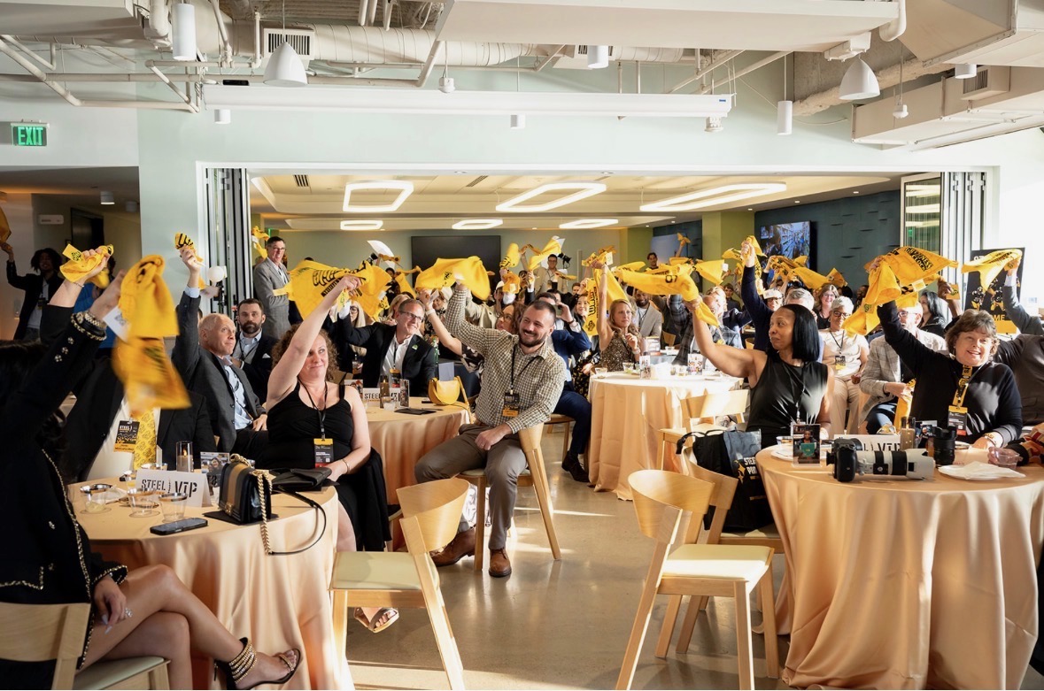 Attendees waive terrible towels at WAF draft party