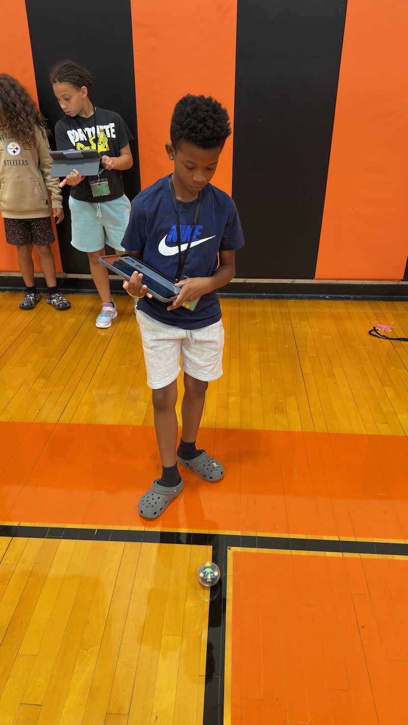 Student testing a robot's mobility