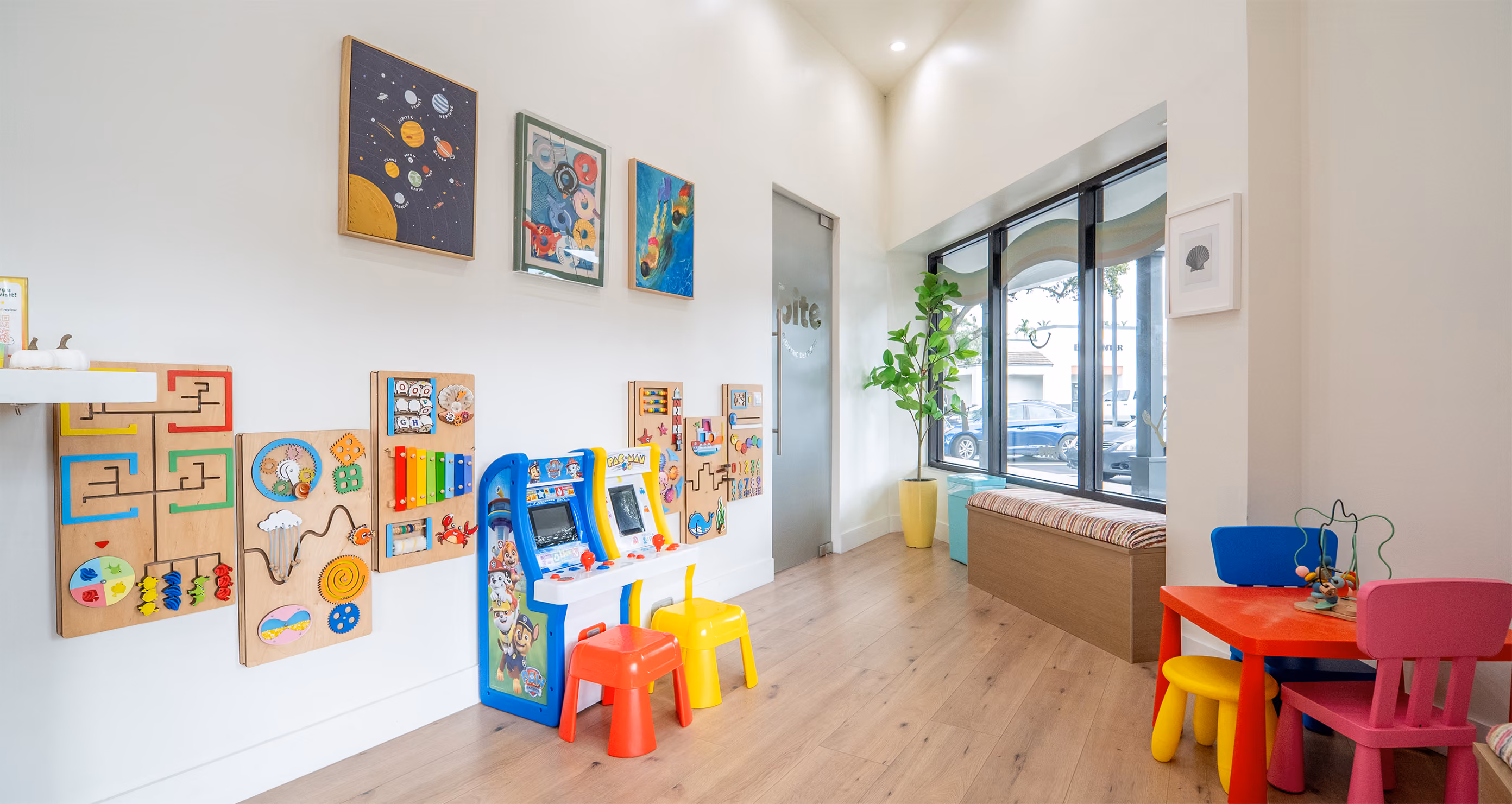 Colorful and inviting lobby at Bite Pediatric Dentistry with toys and a comfortable waiting area"