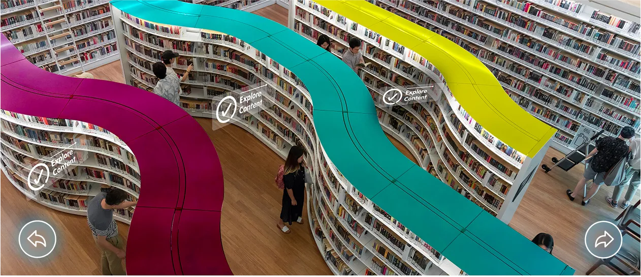 Visual, Virtual Event Environment depicting a library with floating, clickable elements around the room