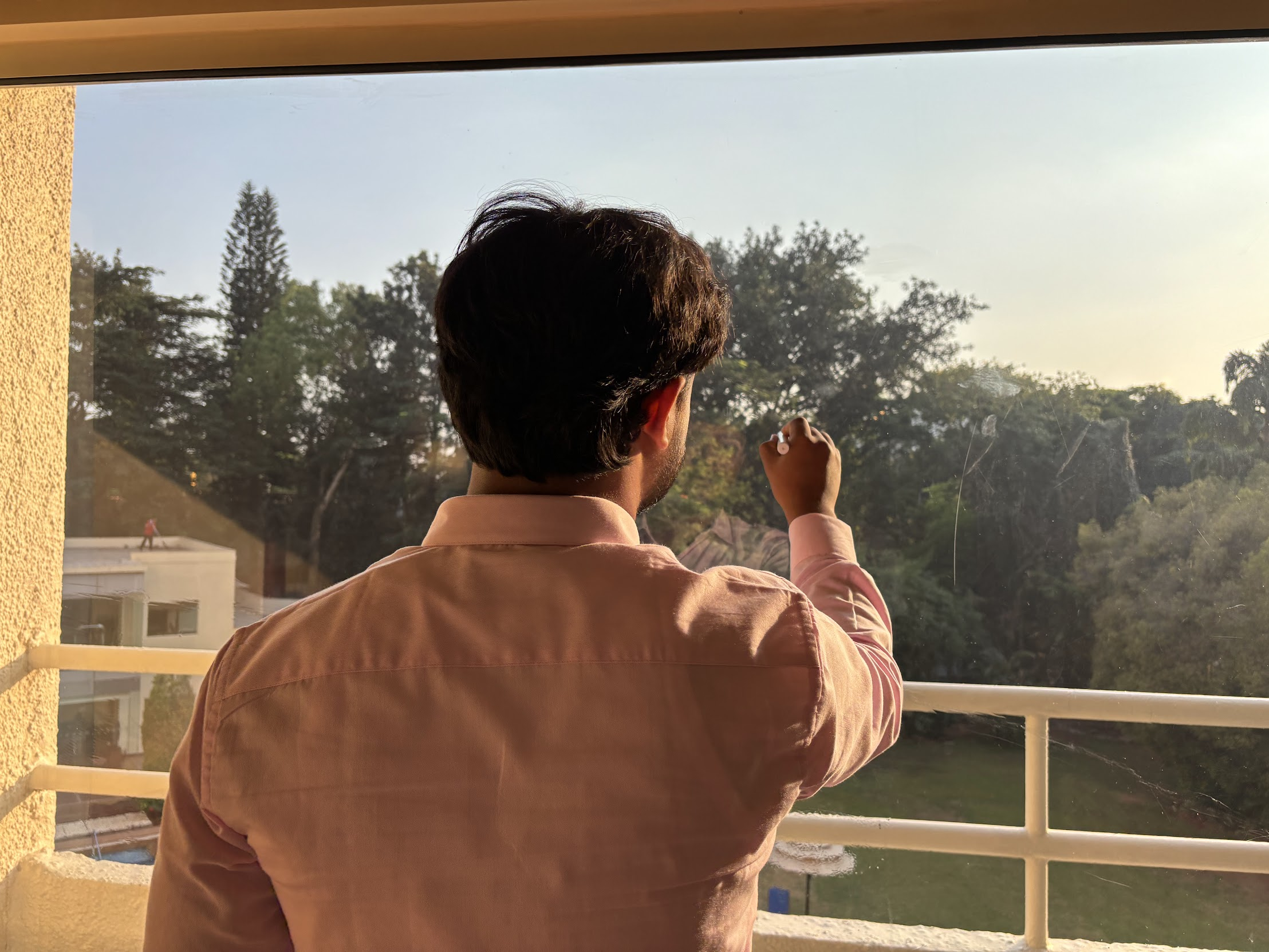 Team member on balcony overlooking greenery