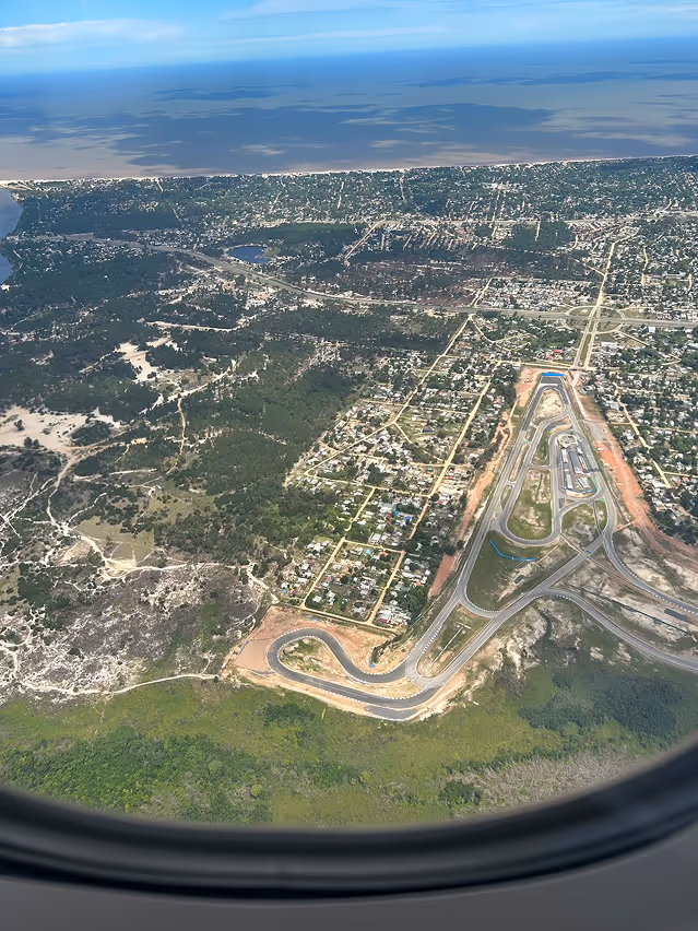 Photograph of a city taken from inside an airplane