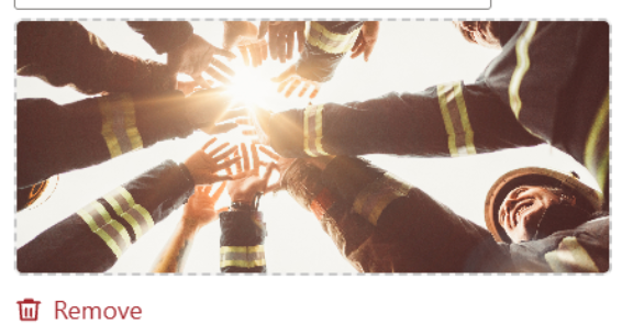 Photograph showing firefighters in uniform joining hands in a circle with sunlight shining through. The image conveys teamwork, unity, and collaboration among emergency responders.AI-generated content may be incorrect.