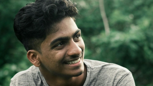 A smiling, young, male Indian type 2 diabetic. 