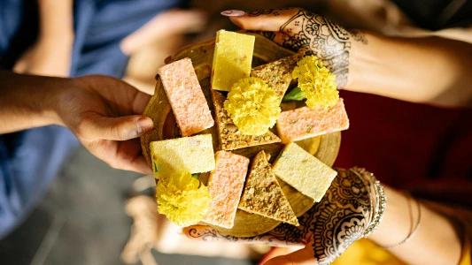 An Indian type 2 diabetic exchanging sweets at a festival. 