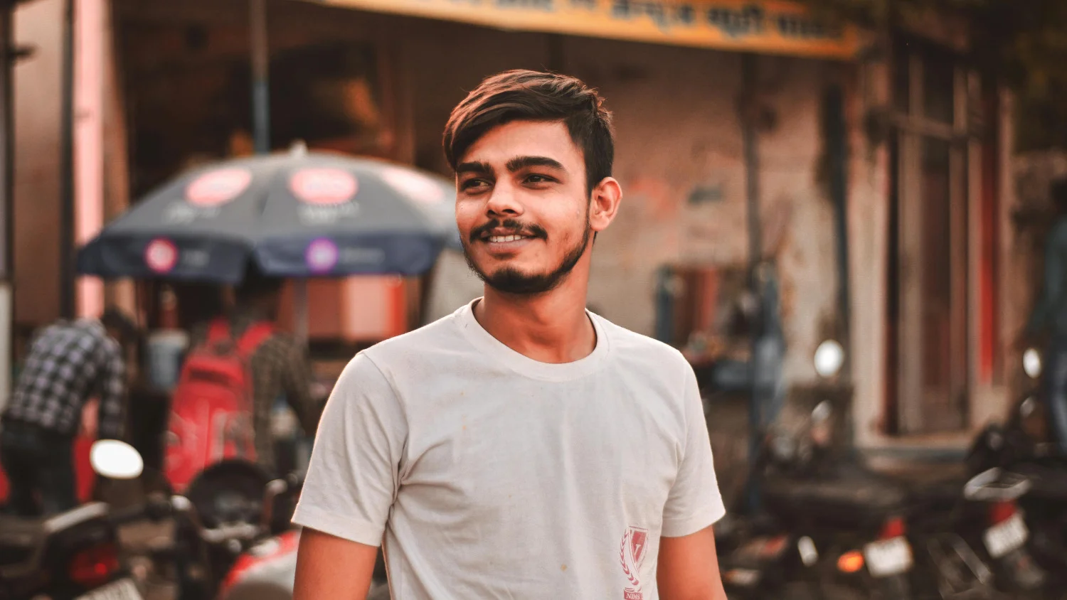 A smiling, young, male Indian type 2 diabetic.