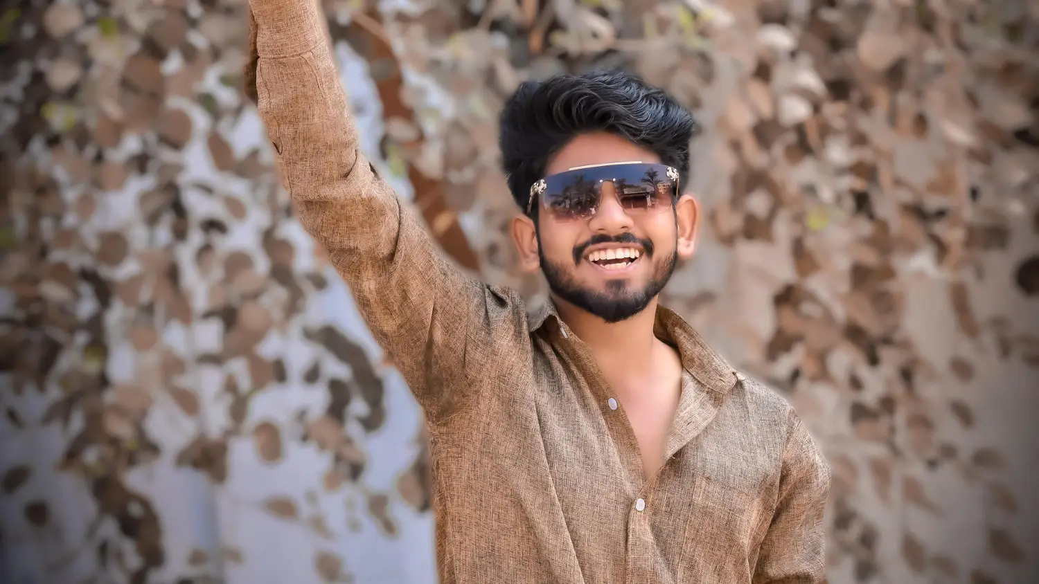 A smiling, young, male Indian type 1 diabetic.