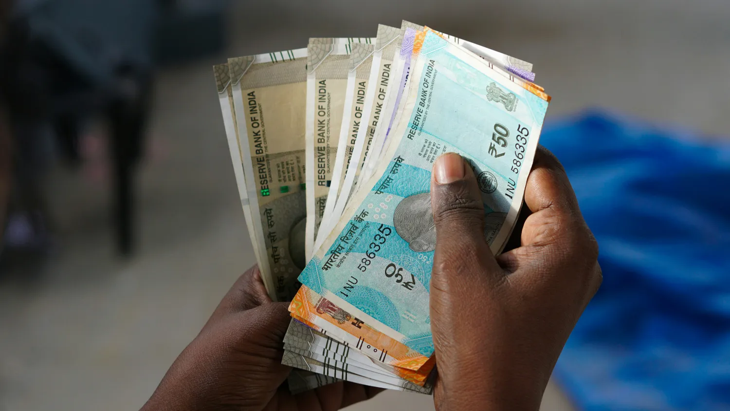 An Indian type 2 diabetic counting money.