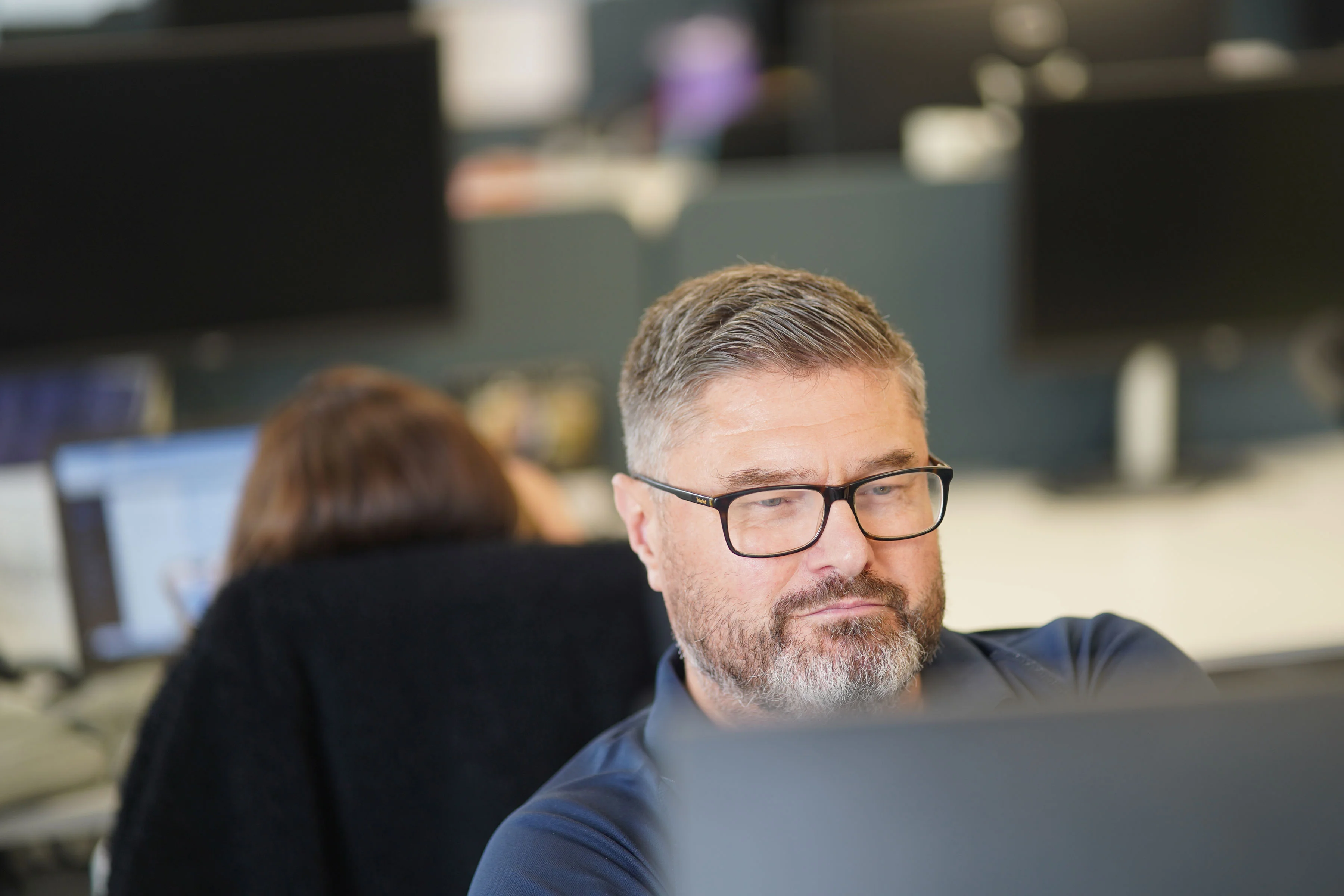 ACS employee looking at screen