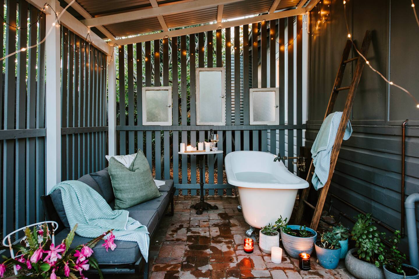 A freestanding bath in the backyard offers a relaxing escape to savour a warm or cold soak by candle light.