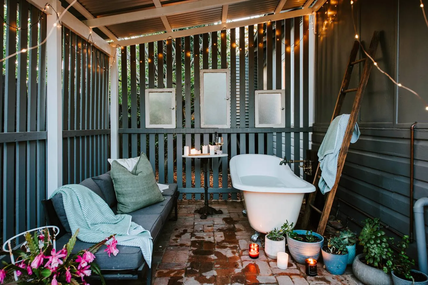 A freestanding bath in the backyard offers a relaxing escape to savour a warm or cold soak by candle light.