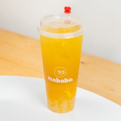 cup of moboba mango green tea with aloe vera jelly