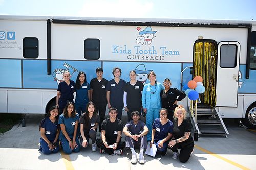 Dr. Alex, husband and 2 dogs on a boat