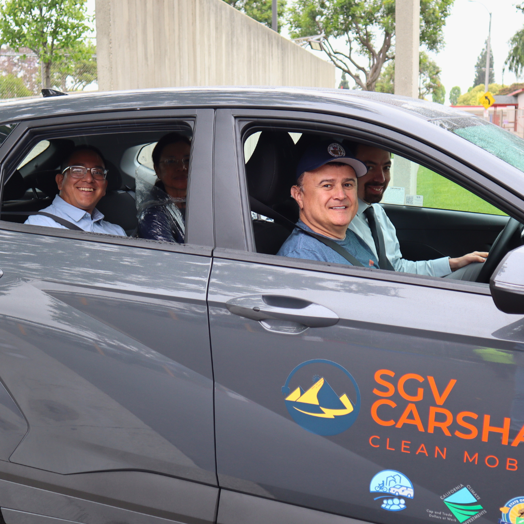 Four community members inside a SGV Carshare vehicle 