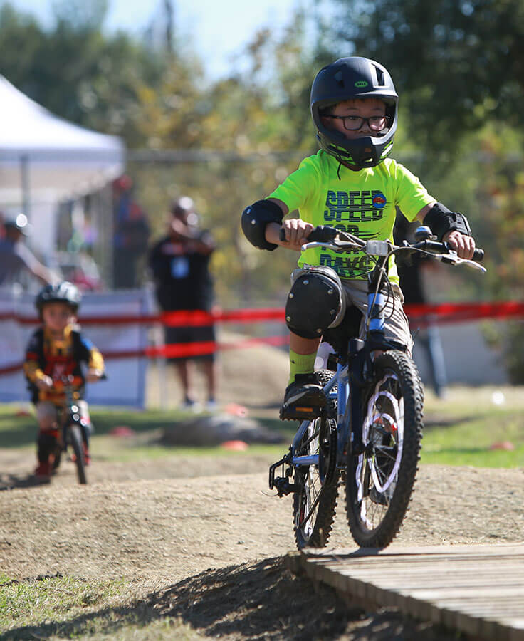 Children ride their bikes on the bike track