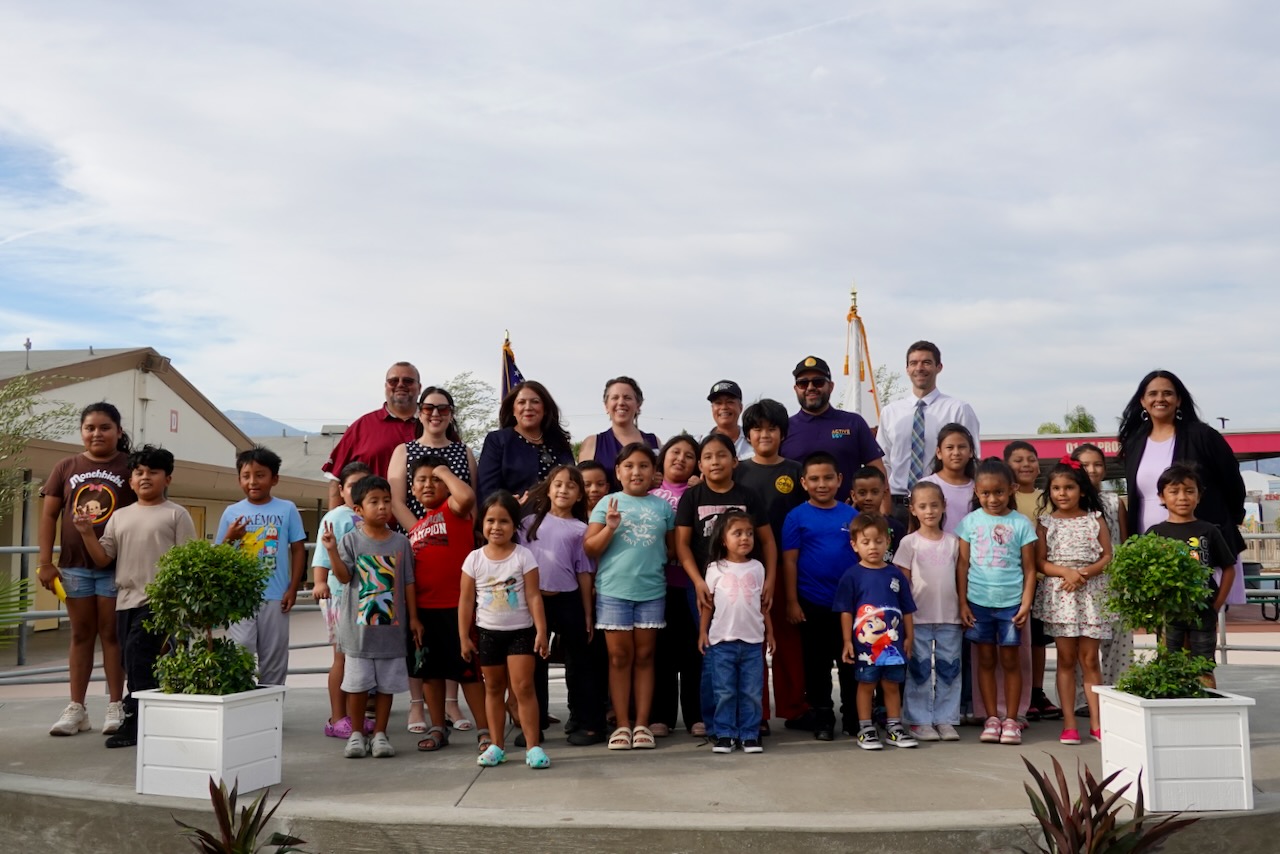 Students, staff, district leaders, and project partners at the ribbon cutting.