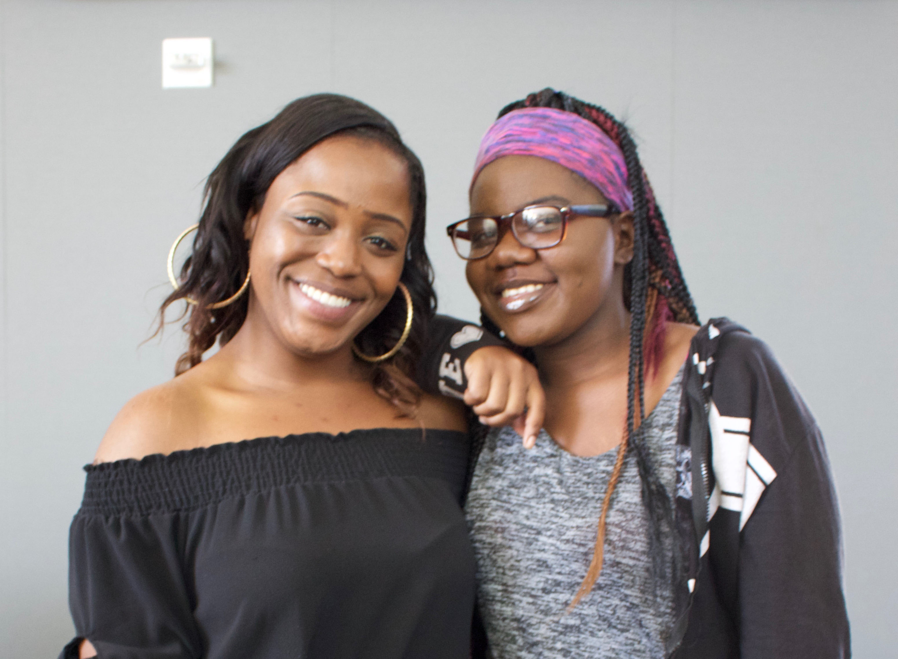 2 young women smiling at the camera