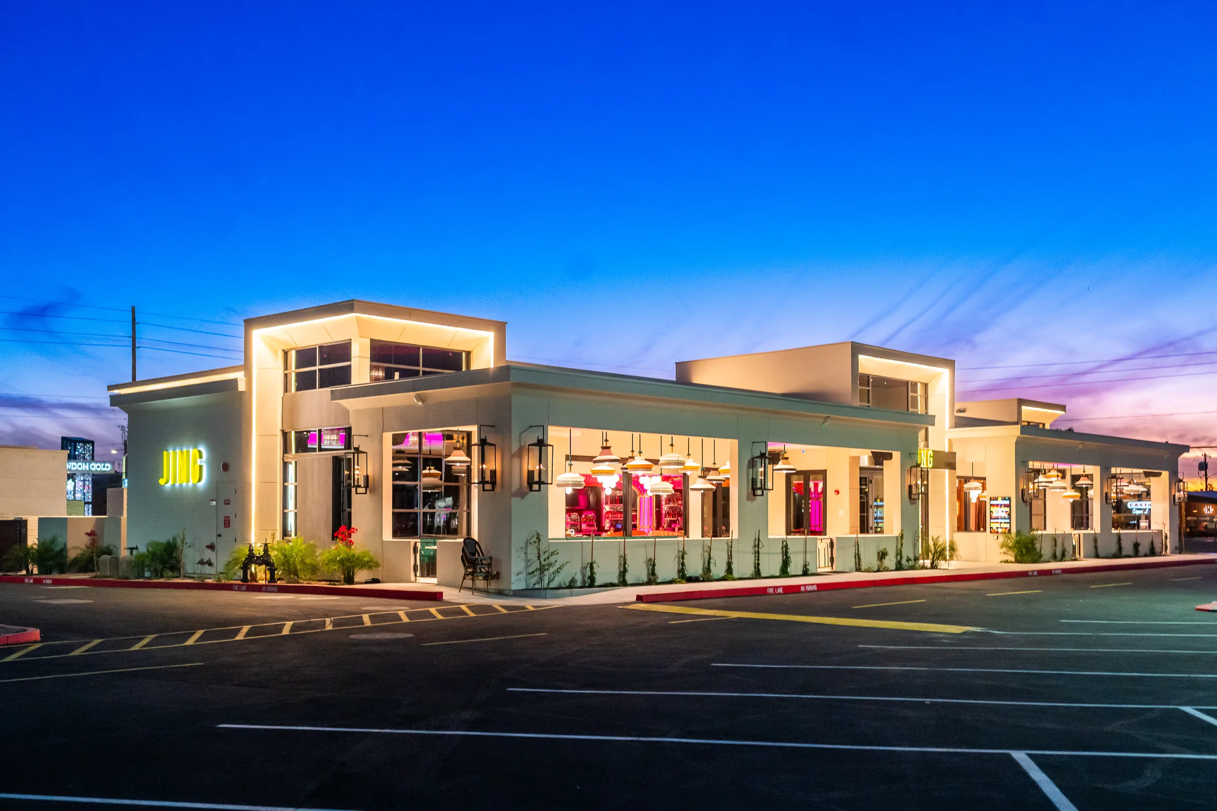 Jing Scottsdale exterior at dusk with new landscaping and site work