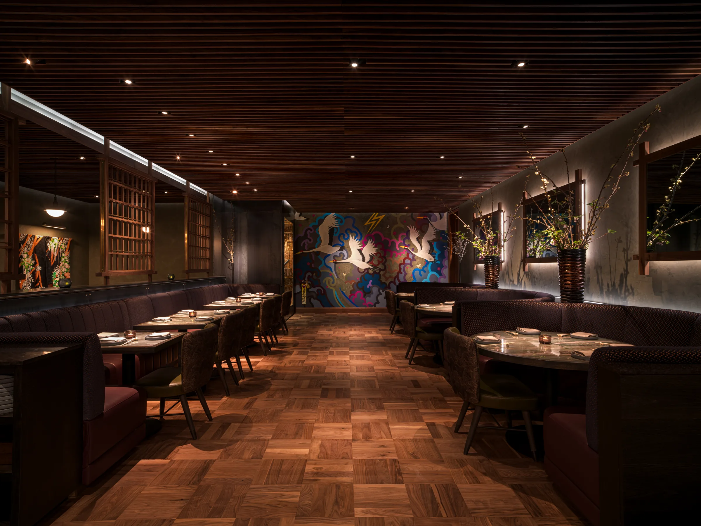 Nomikai main dining room with booth seating and painted mural