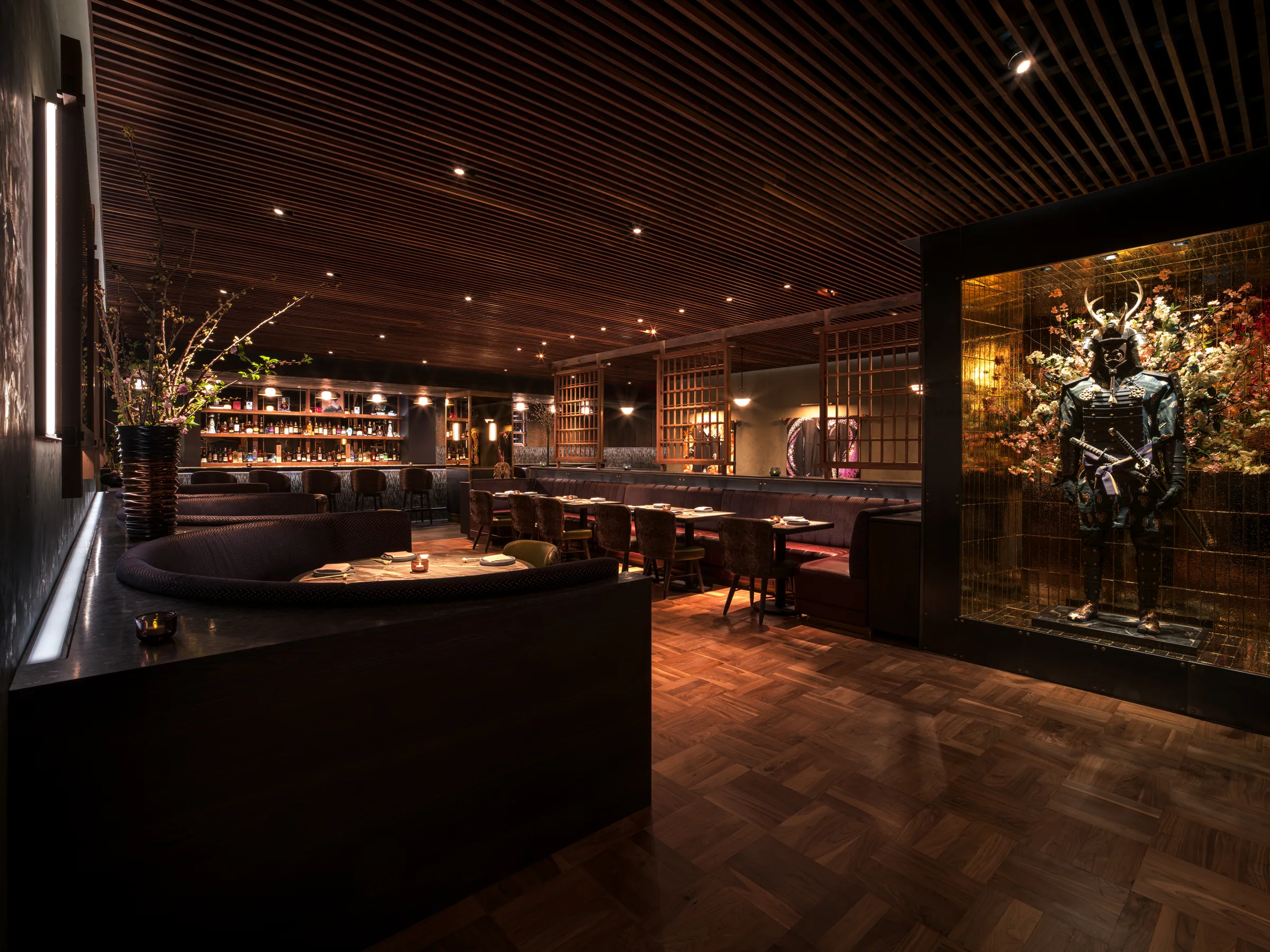 Nomikai dining room with the samurai statue display case and millwork ceiling