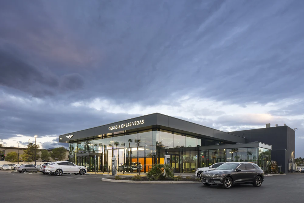 Genesis of Las Vegas glass showroom exterior at dusk