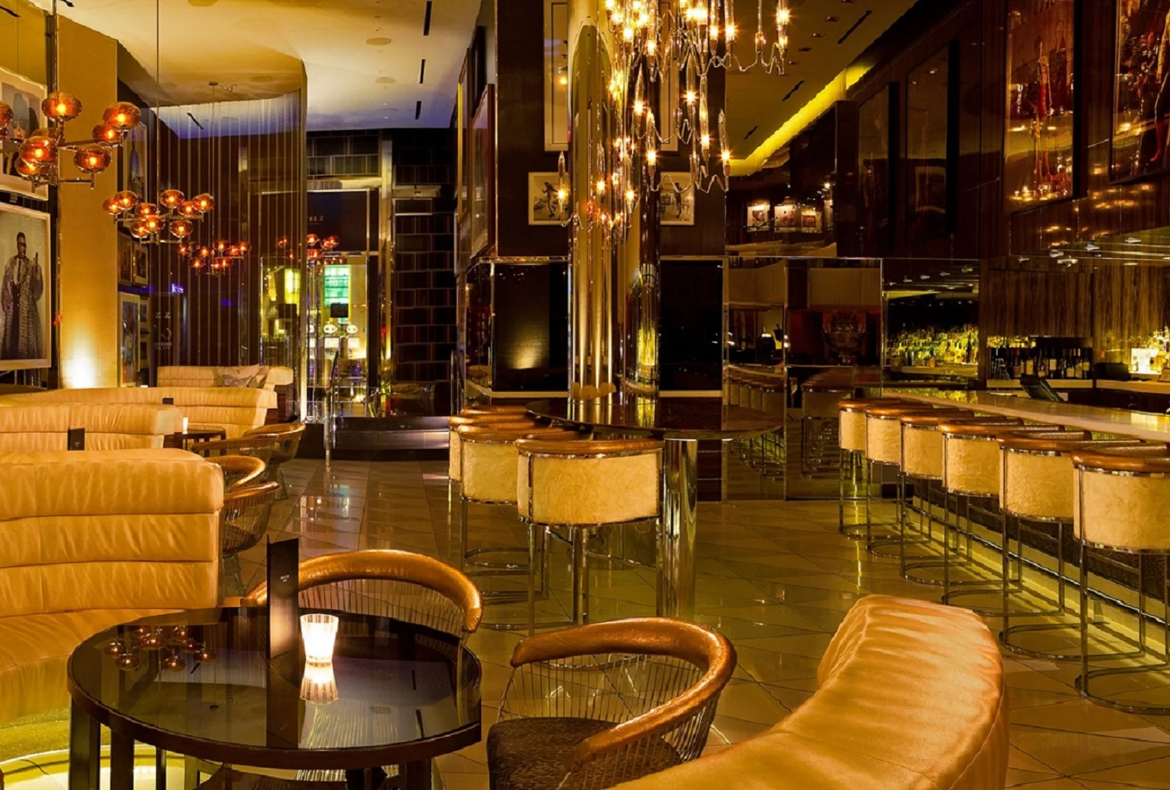 Fizz champagne lounge at Caesars Palace with chandeliers, bronze finishes, and cream seating