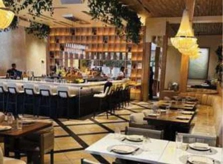 The Guest House dining room and bar with custom wood detailing