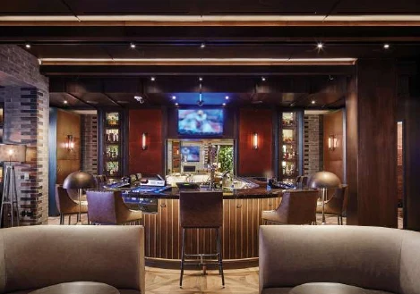 Montecristo lounge entrance framed by wood millwork