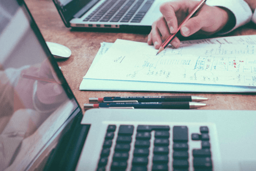 Header image showing a hand and keyboard for decorative purposes.