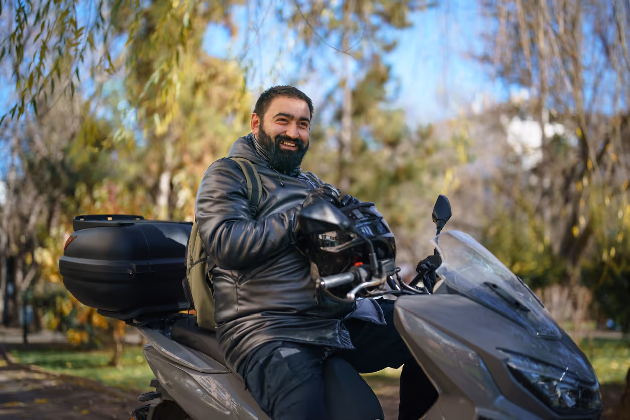 Man sitting on his motorbike in streets