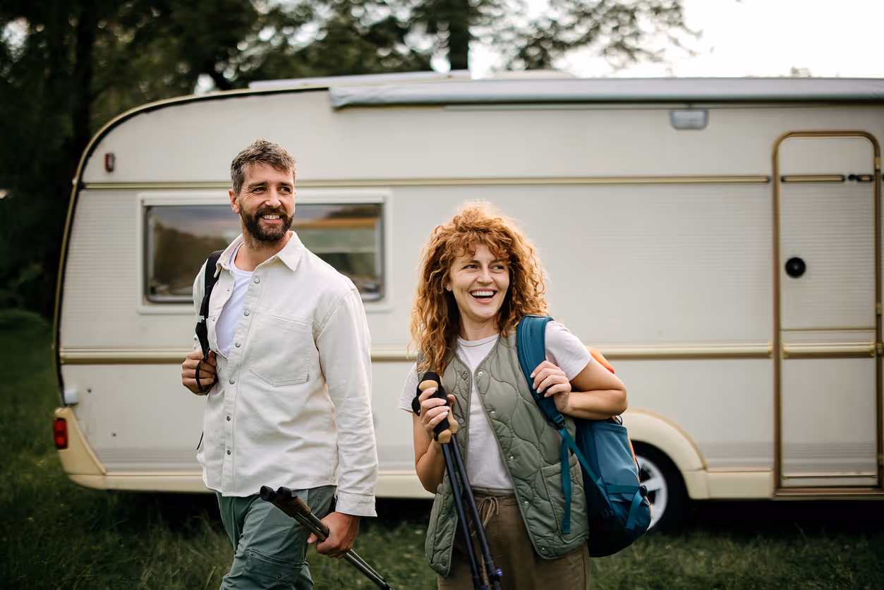 couple outside of camper