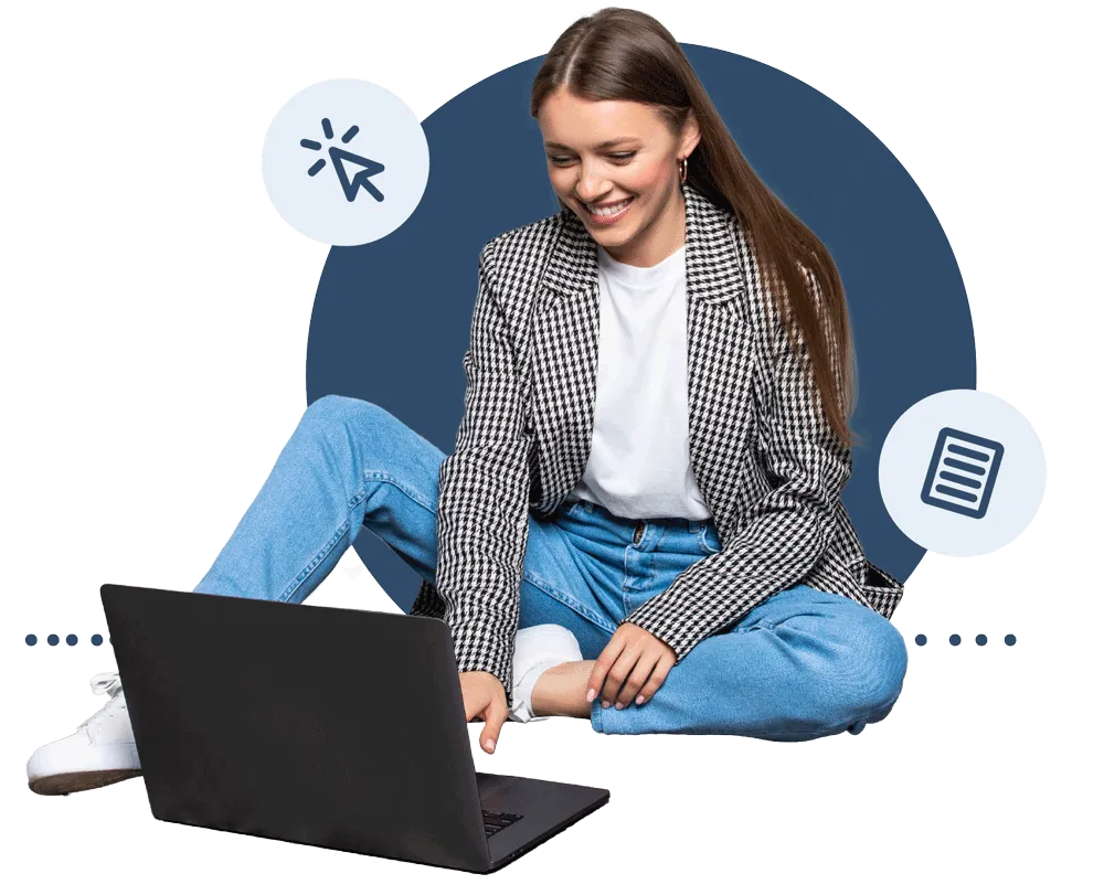 Young woman sitting on floor looking at a laptop