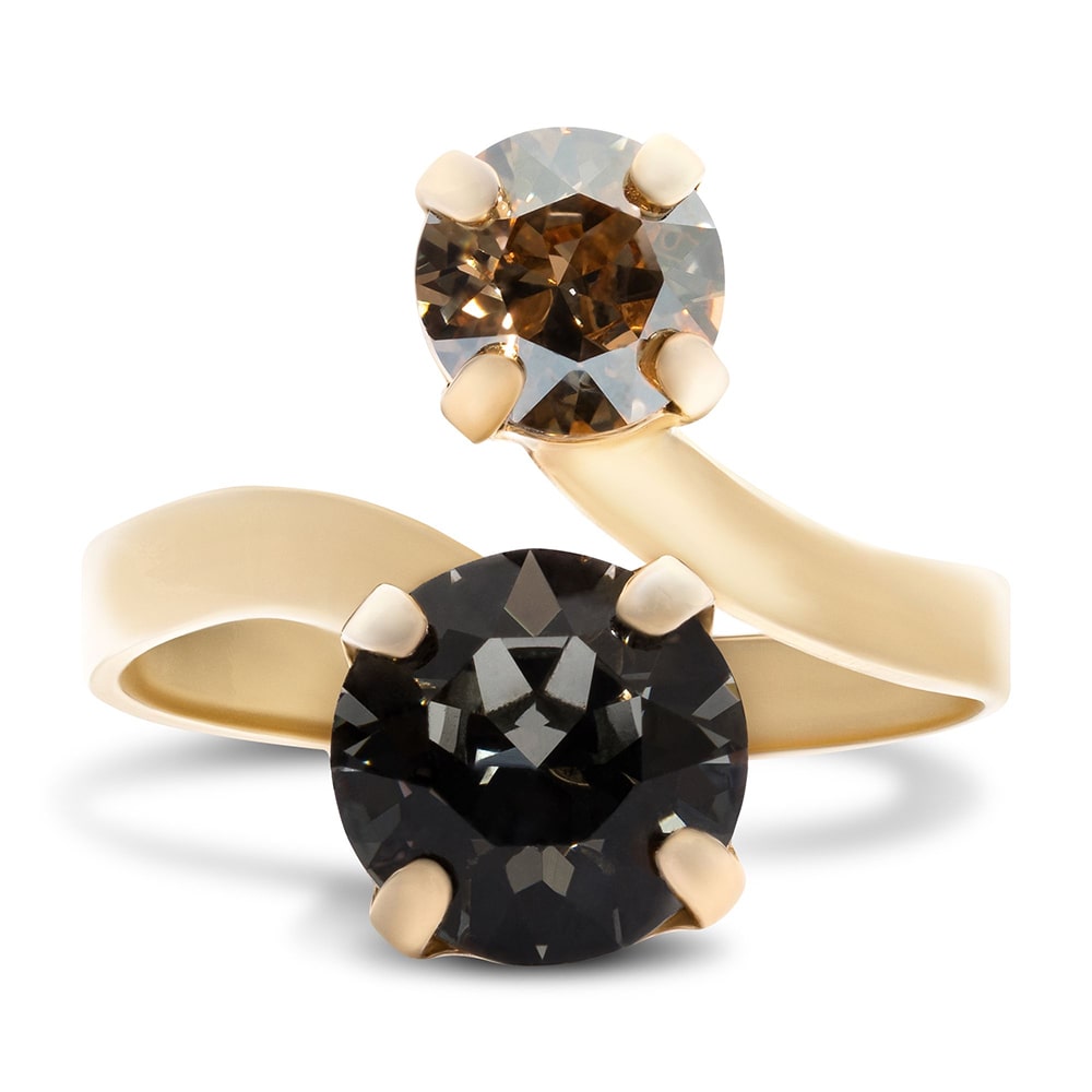 golden ring with dark gems shot on a white background