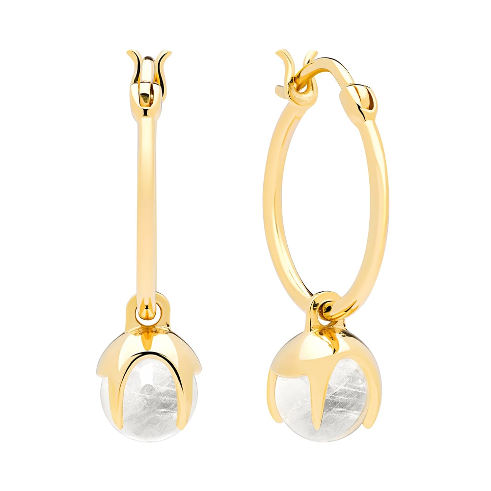 golden hanging earings with pearls shot on a white background