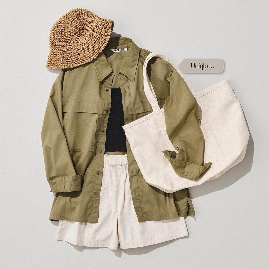 Neutral outdoor outfit flat lay with jacket, shorts, and hat