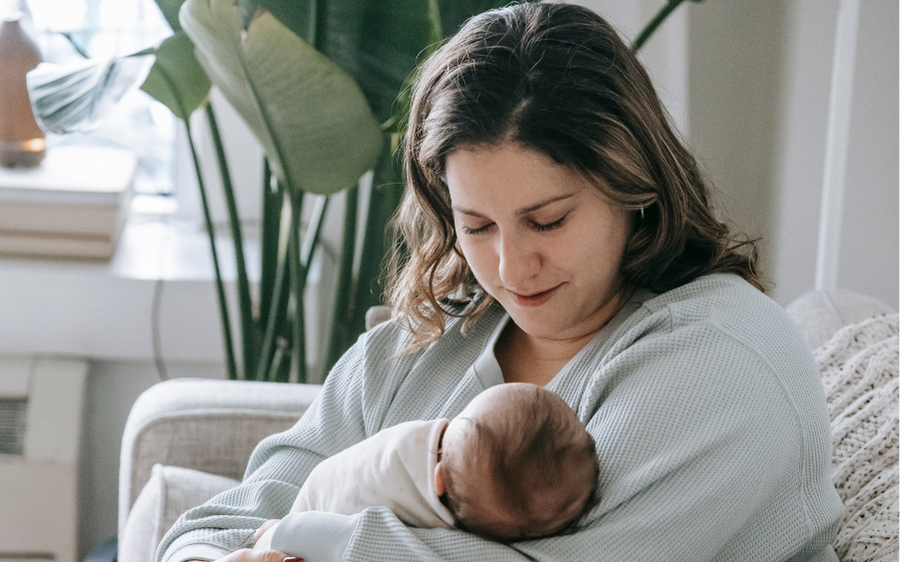 mom breastfeeding newborn baby