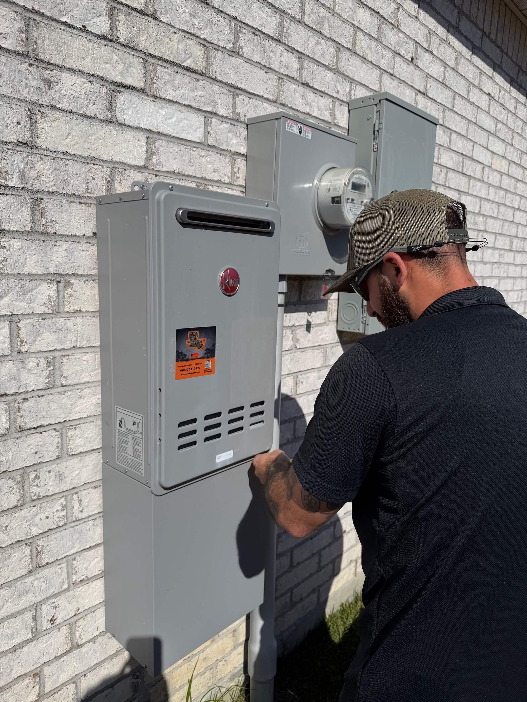 Northshore Water Heater Repair; Anthony repairing a tankless water heater