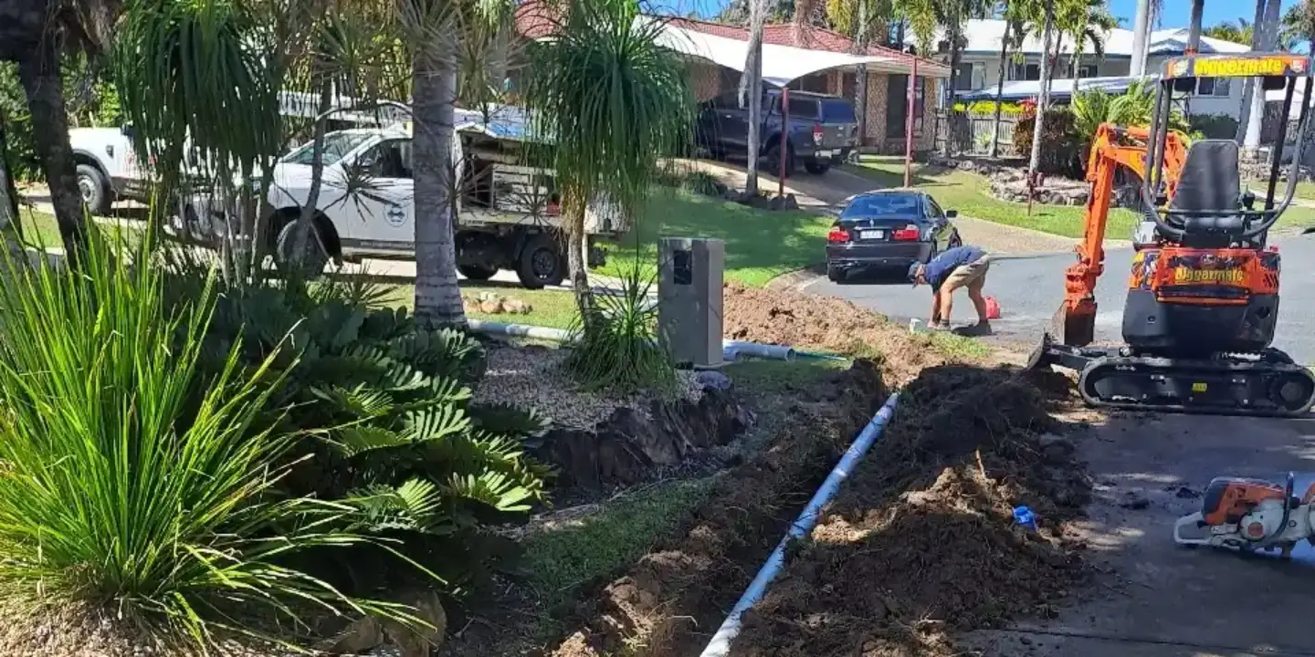 Ongoing underground pipe installation by Tropical Coast Plumbing in a residential Rockhampton driveway