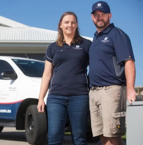 Tropical Coast Plumbing staff in Yeppoon outside a residential property, prepared for plumbing maintenance and emergency call-outs.