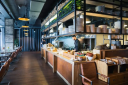 Modern Yeppoon restaurant kitchen showcasing a commercial fit-out, with professional plumbing work ensuring compliance, drainage, and water supply.