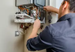 Professional gas fitting in Townsville with a licensed plumber repairing and maintaining a gas hot water system for residential use.