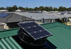 SolarKing solar roof ventilation fan installed on a green metal roof in Townsville, removing hot air and improving home comfort.